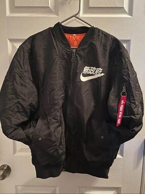 Nike Black Bomber Jacket with White Logo and Red Zip Tag